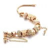Trendy gold bracelet with charms - hearts - beads - clover - keyBracelets