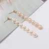Elegant long golden earrings - geometric metal with pearlsEarrings