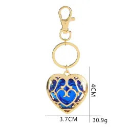Crystal heart in golden cage - keychainKeyrings