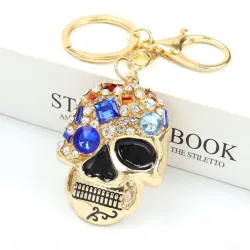 Golden keychain with crystal skullKeyrings