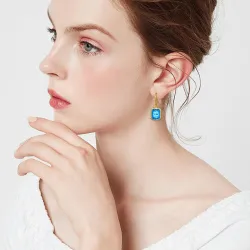 Golden earrings with blue crystal topaz / rhinestonesEarrings