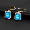 Golden earrings with blue crystal topaz / rhinestonesEarrings