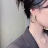 Elegant golden round earrings - with white opalEarrings