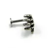 Body piercing with skull handEarrings