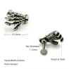 Body piercing with skull handEarrings
