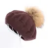 Elegant beret with fur pom-pomHats & Caps
