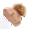 Elegant beret with fur pom-pomHats & Caps
